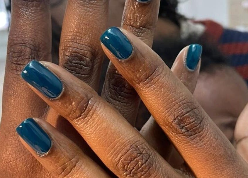 Stylish nail art with blue polish at HD Beauty Parlor in Cape Town, Western Cape, ZA.