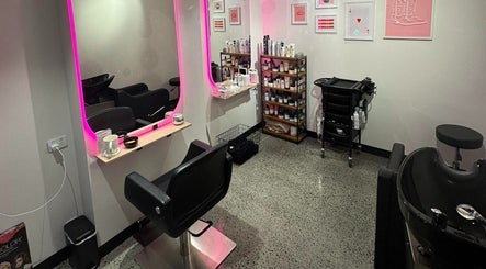 Modern salon setup at Maddi Jane Hair Studio, Southport, Queensland, AU, featuring a stylish mirror and seating.
