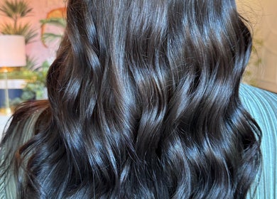 Luxurious wavy dark hair styled at Maddi Jane Hair Studio, Southport, Queensland, AU.