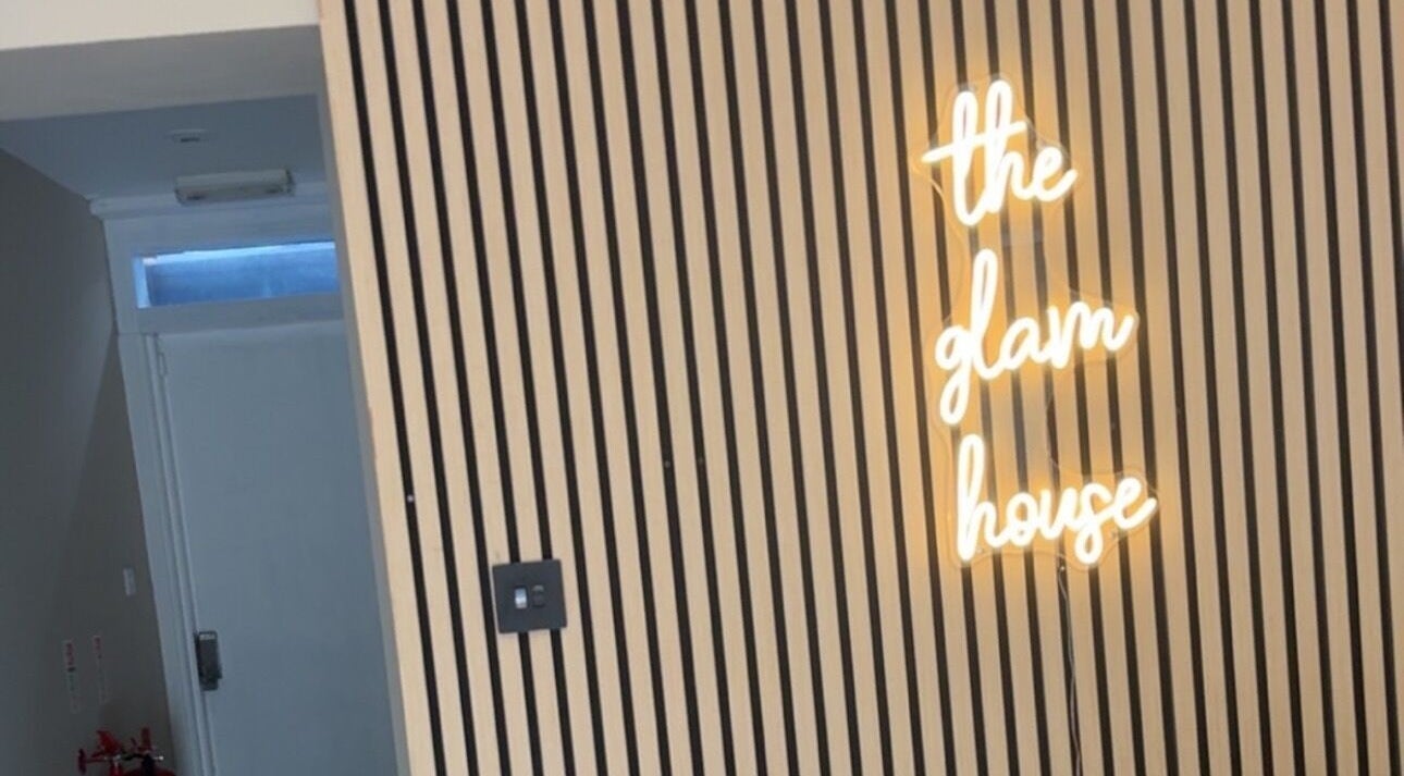 Neon sign on striped wall at Envision Aesthetics (Edinburgh), Edinburgh, Scotland, GB.