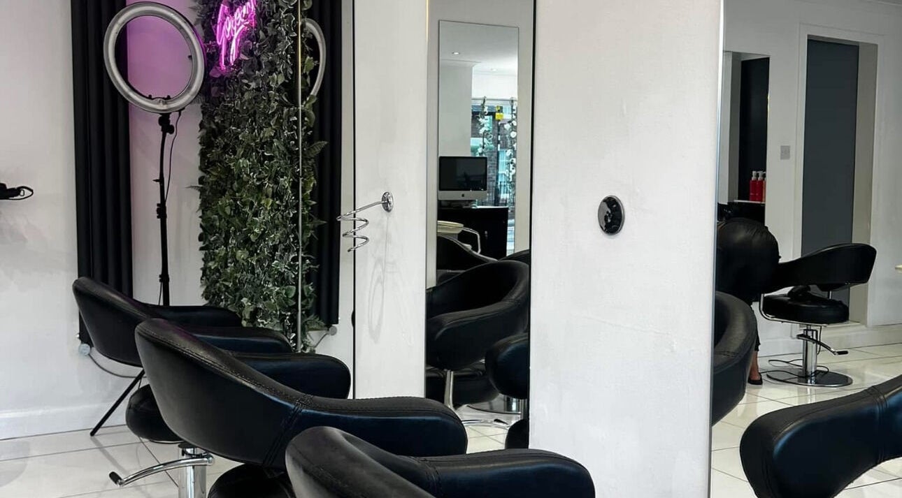 Modern styling chairs and mirrors at Envision Aesthetics in Newtongrange, Scotland, GB enhance the salon experience.