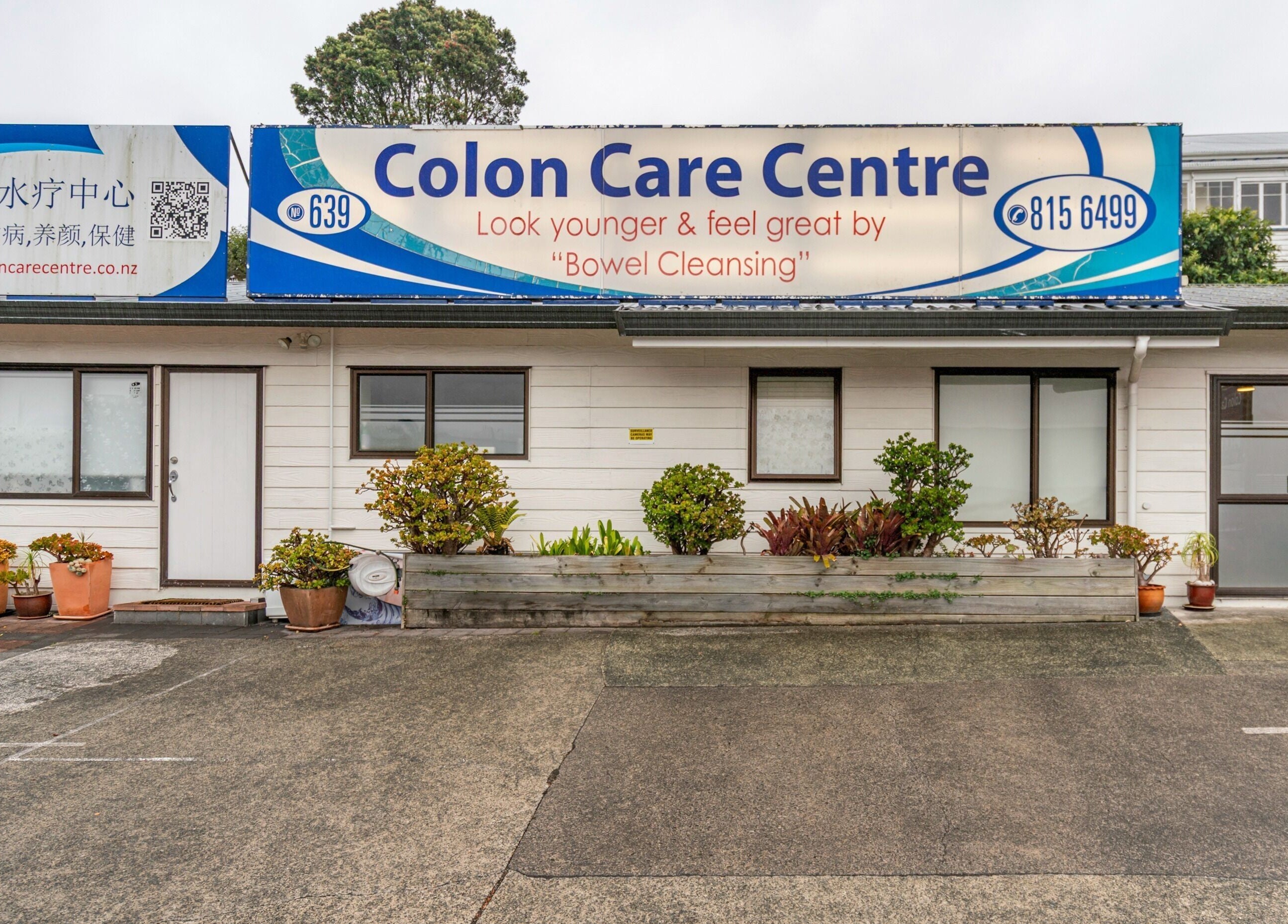 Front view of Colon Care Centre on a cloudy day in Auckland, Auckland, NZ featuring entrance and signage.