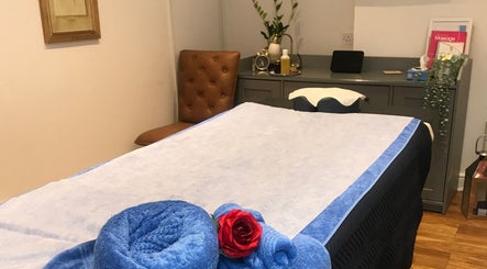 Relaxing massage room at Thawee Thai Therapy in Shirley, England, GB, featuring a neatly set treatment bed.