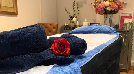 Cozy massage table with elegant decor at Thawee Thai Therapy in Shirley, England, GB.