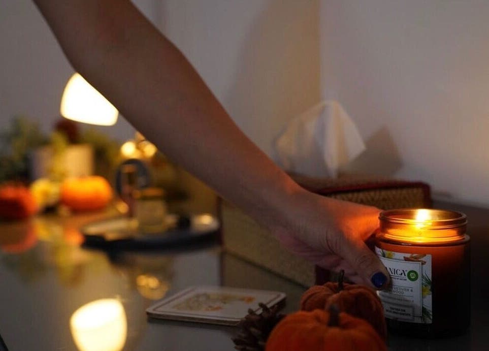 A lit candle setting a calming ambiance at Thawee Thai Therapy in Solihull, England, GB.