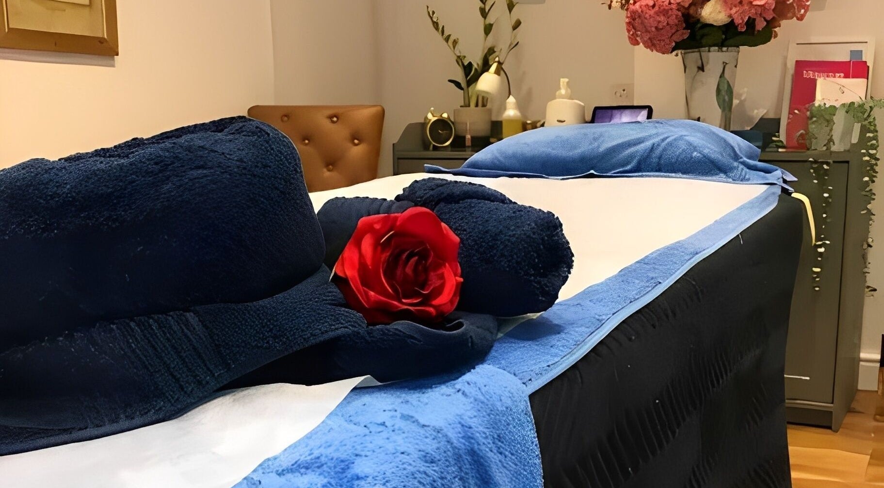 Relaxing treatment room at Thawee Thai Therapy in Shirley, England, GB, with a cozy massage bed and floral decor.