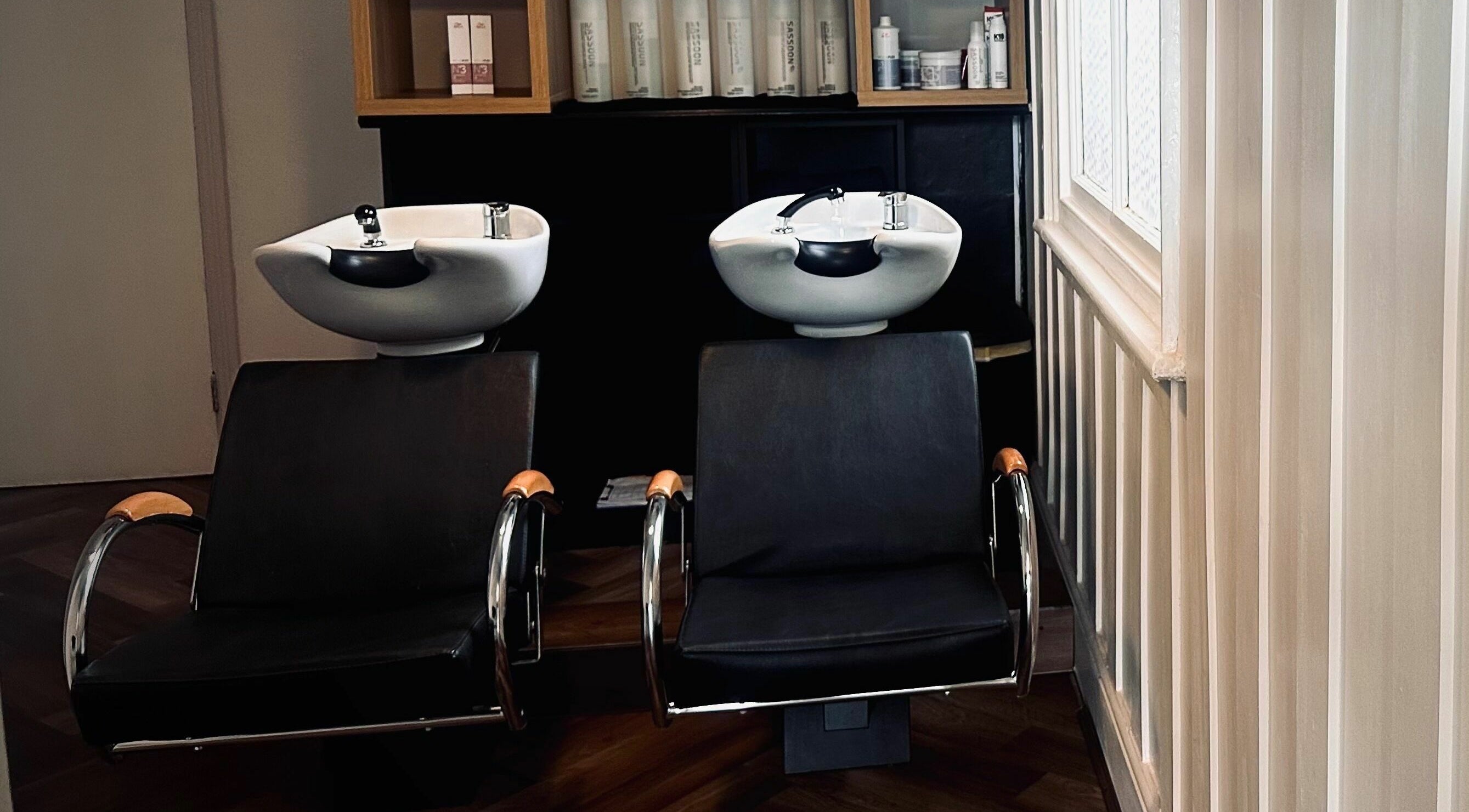 Chic wash stations at Nathan Richardson Hair, Sheffield, England, GB, set in a modern interior.