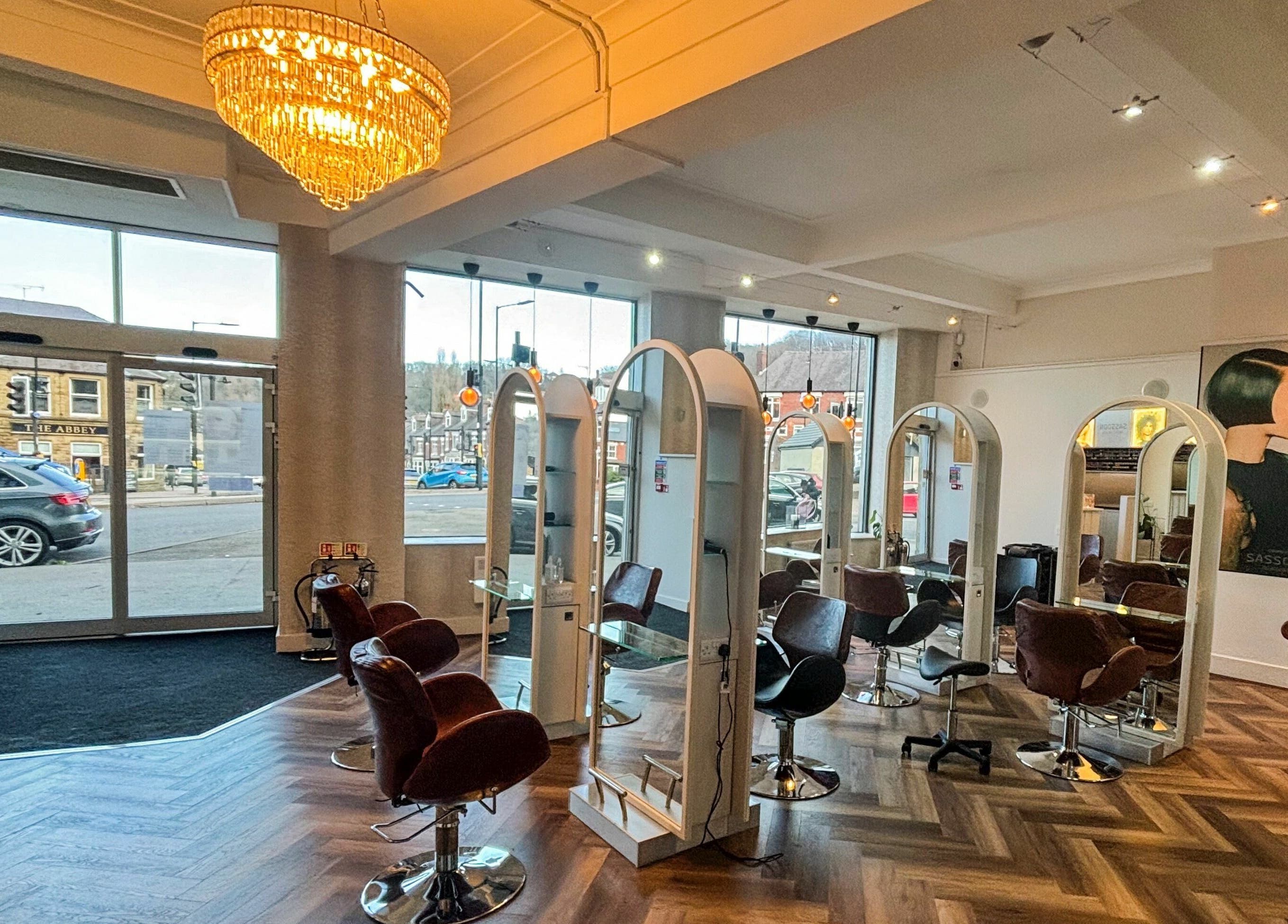 Elegant interior of Nathan Richardson Hair in Sheffield, England, GB, showcasing stylish salon chairs and mirrors.
