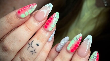 Vibrant neon nail art with gems at Cw Artistry, Glasgow, Scotland, GB.