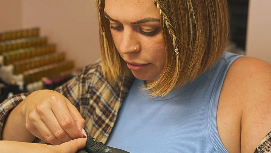 Nail technician working on a client at The Nail Lady, Leigh-on-Sea, England, GB.