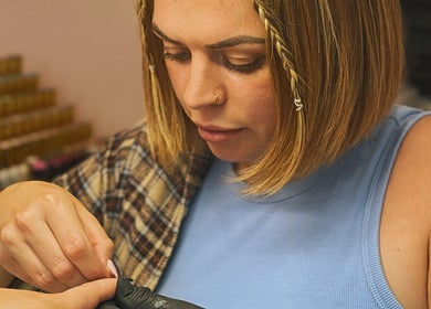 Nail technician working on a client at The Nail Lady, Leigh-on-Sea, England, GB.