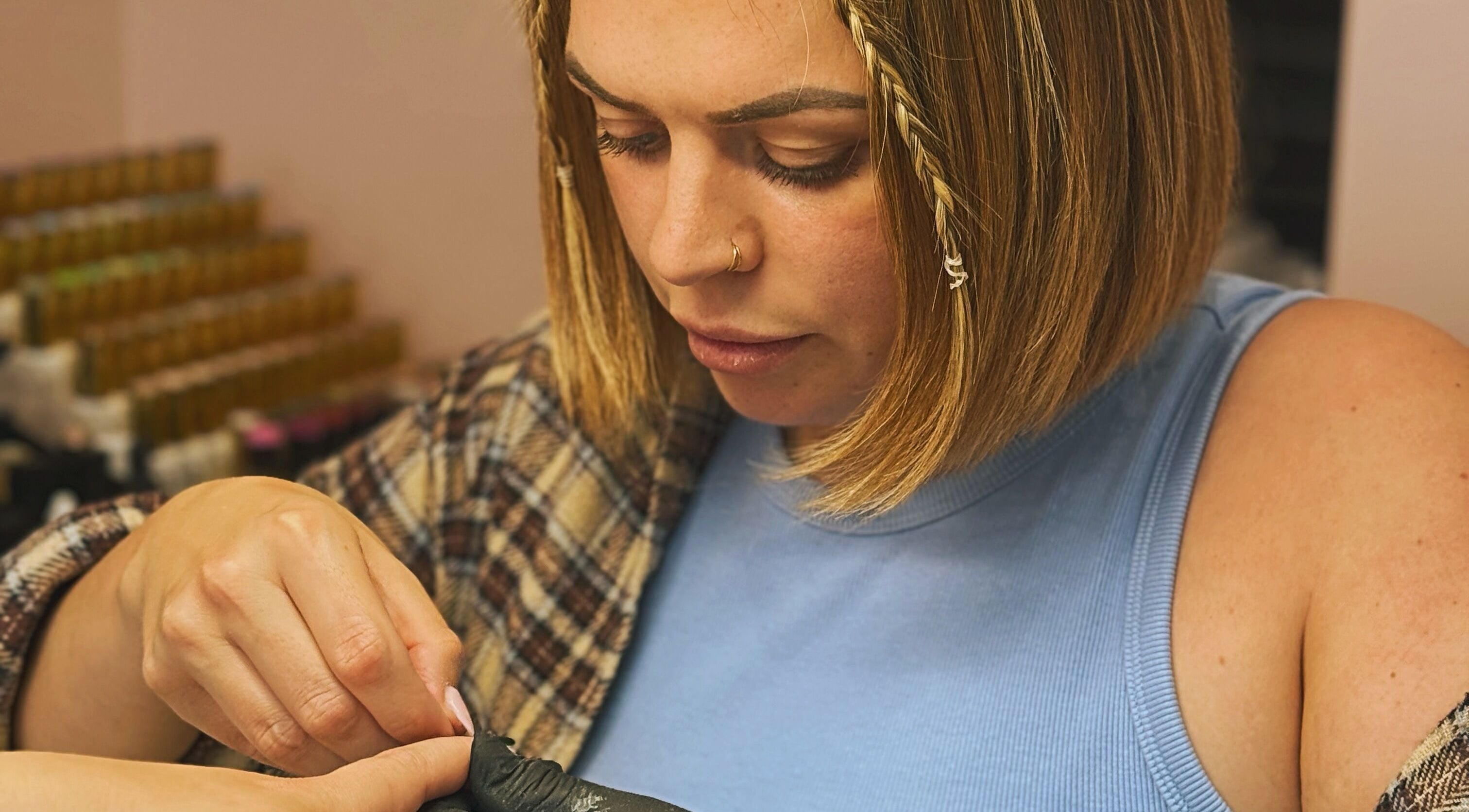 Nail technician working on a client at The Nail Lady, Leigh-on-Sea, England, GB.