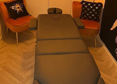 Comfortable massage table in a serene room at Wellness at Happy Buddha, Poole, England, GB.