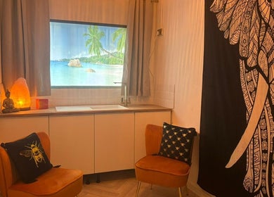 Relaxing wellness space at Wellness at Happy Buddha, Poole, England, GB with cozy chairs and calming decor.