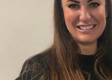 Friendly team member at Unique Beauty and Aesthetics, Chorley, England, GB, welcoming clients with a smile.