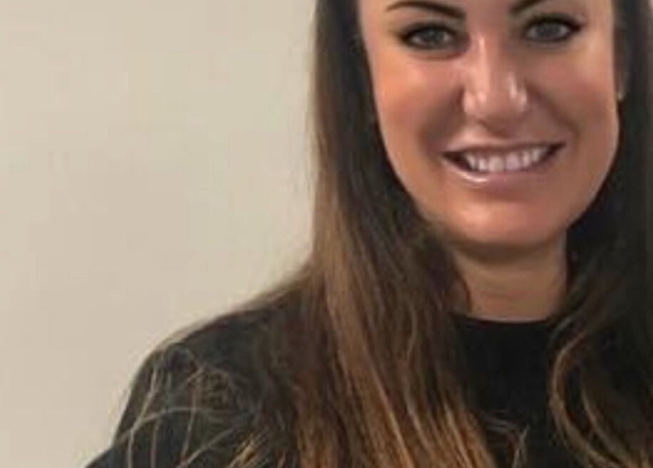 Friendly team member at Unique Beauty and Aesthetics, Chorley, England, GB, welcoming clients with a smile.