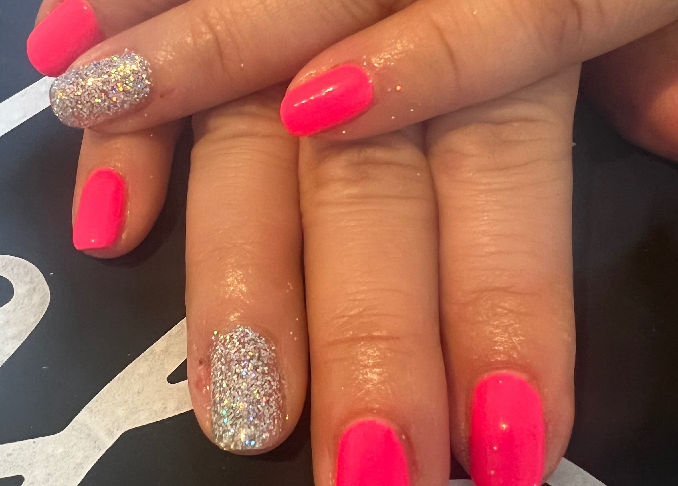 Bright pink and glitter nails at Unique Beauty and Aesthetics, Chorley, England, GB.