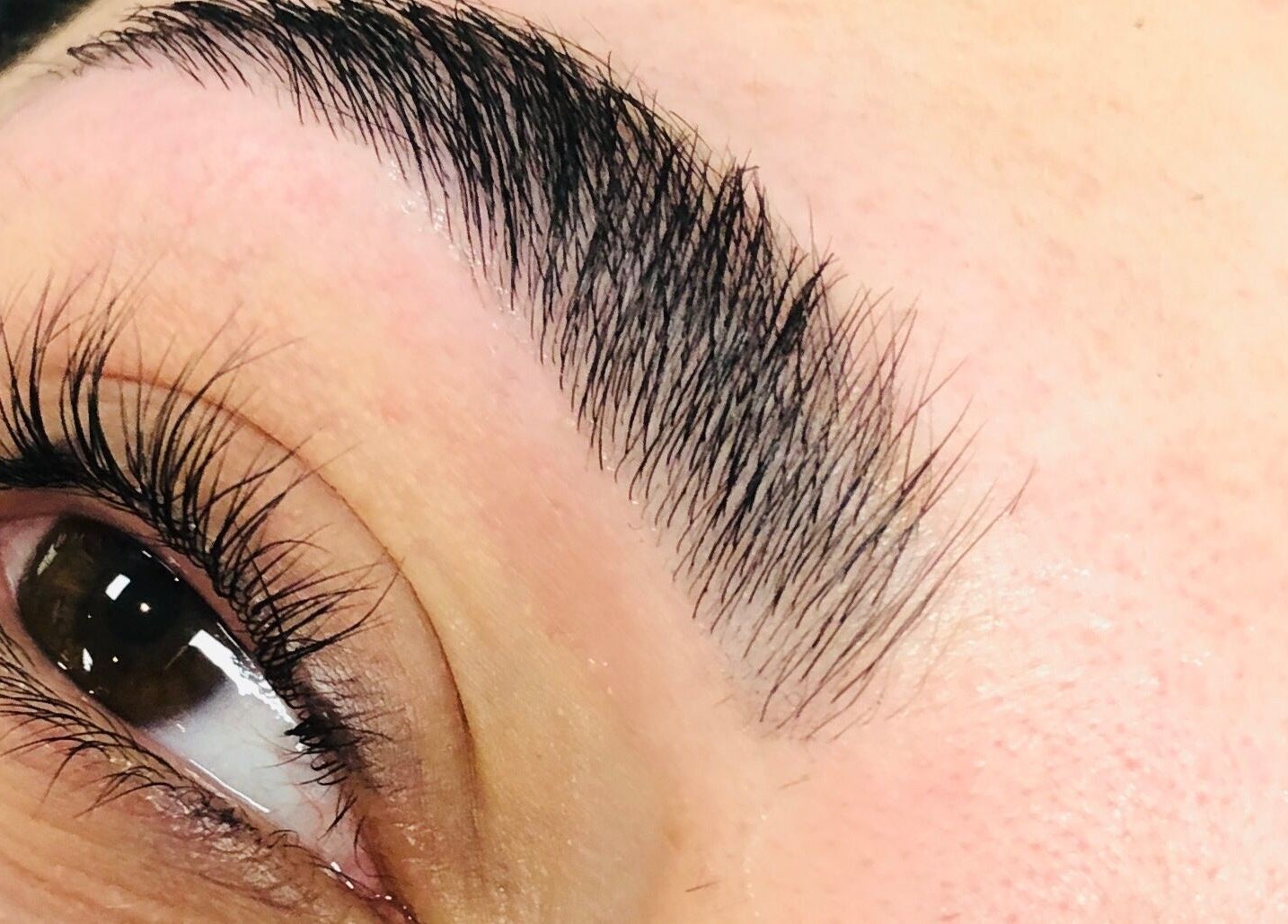 Close-up of expertly shaped eyebrows at Unique Beauty and Aesthetics in Chorley, England, GB.
