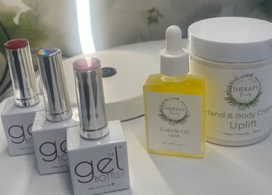 Beauty products at Therapy Beauty, Wakefield, England. Featuring gel polish, cuticle oil, and body cream.