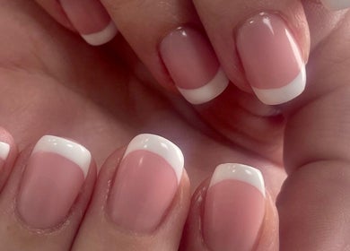 Beautiful French manicure at Therapy Beauty, Wakefield, England, GB, highlighting precision and elegance.