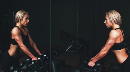 Fitness enthusiast lifting weights at YourPT @BestU Body Lab, Melbourne, Victoria, AU.