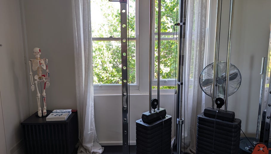 YourPT @ BestU Body Lab, Melbourne, Victoria, AU: fitness equipment and anatomical model in bright room.