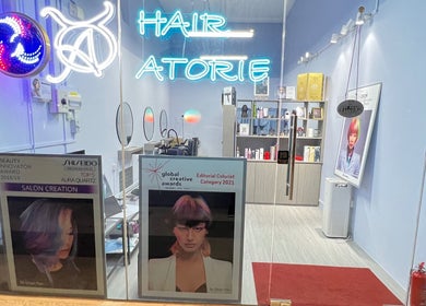 Bright Hair Atorie salon in Singapore, SG showcasing awards and modern interior decor.