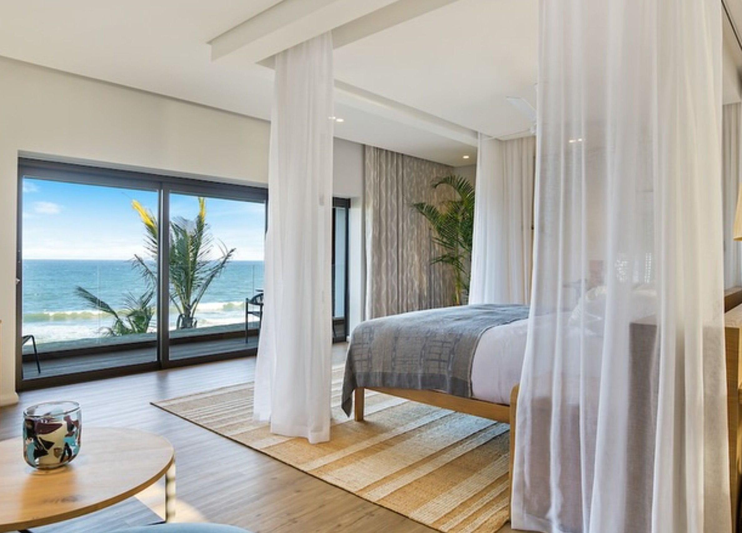 Luxurious bedroom at Sala Beach Spa with ocean views in Dolphin Coast, KwaZulu-Natal, ZA.