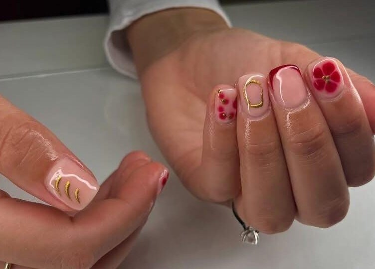 Elegant floral nail art design at Beauty by Hannah in Willenhall, England, GB. Perfect for a chic look.