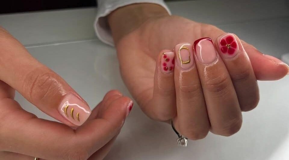 Elegant floral nail art design at Beauty by Hannah in Willenhall, England, GB. Perfect for a chic look.