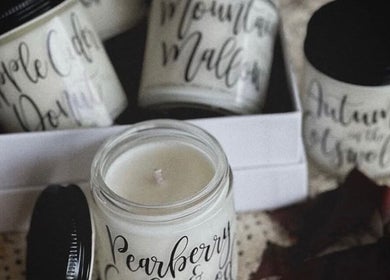 Handcrafted scented candles at RèFINE Boutique Salon, Morton Grove, Illinois, US enhance tranquil ambience.