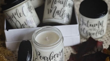 Handcrafted scented candles at RèFINE Boutique Salon, Morton Grove, Illinois, US enhance tranquil ambience.