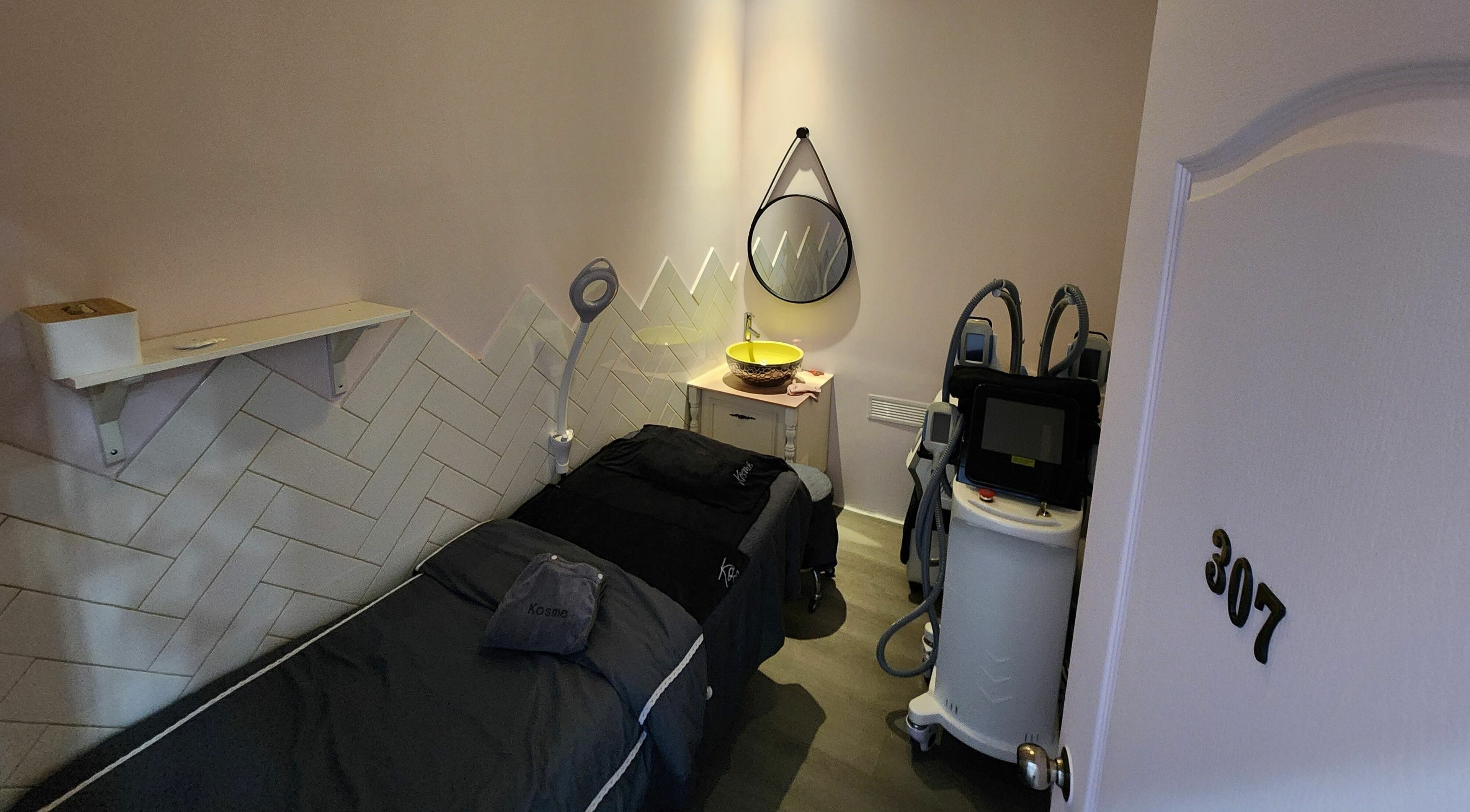 Serene treatment room at Kosme Aesthetics - Orchardgateway, Singapore, Singapore, SG, featuring modern equipment.