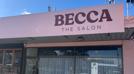 Entrance of Becca Hair and Beauty in Melbourne, Victoria, AU with a pink signboard.
