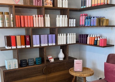 Becca Hair and Beauty's product display shelf in Melbourne, Victoria, AU showcasing premium hair care items.