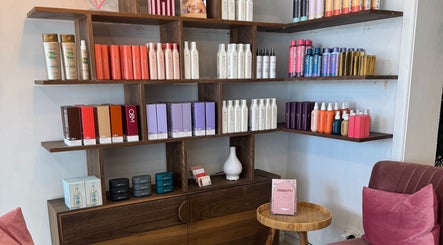 Becca Hair and Beauty's product display shelf in Melbourne, Victoria, AU showcasing premium hair care items.