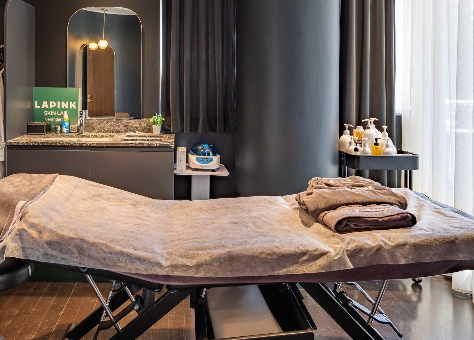 Luxurious treatment room at Lapink Skin Lab, Barangaroo, New South Wales, AU. Tranquil spa with cozy linens.