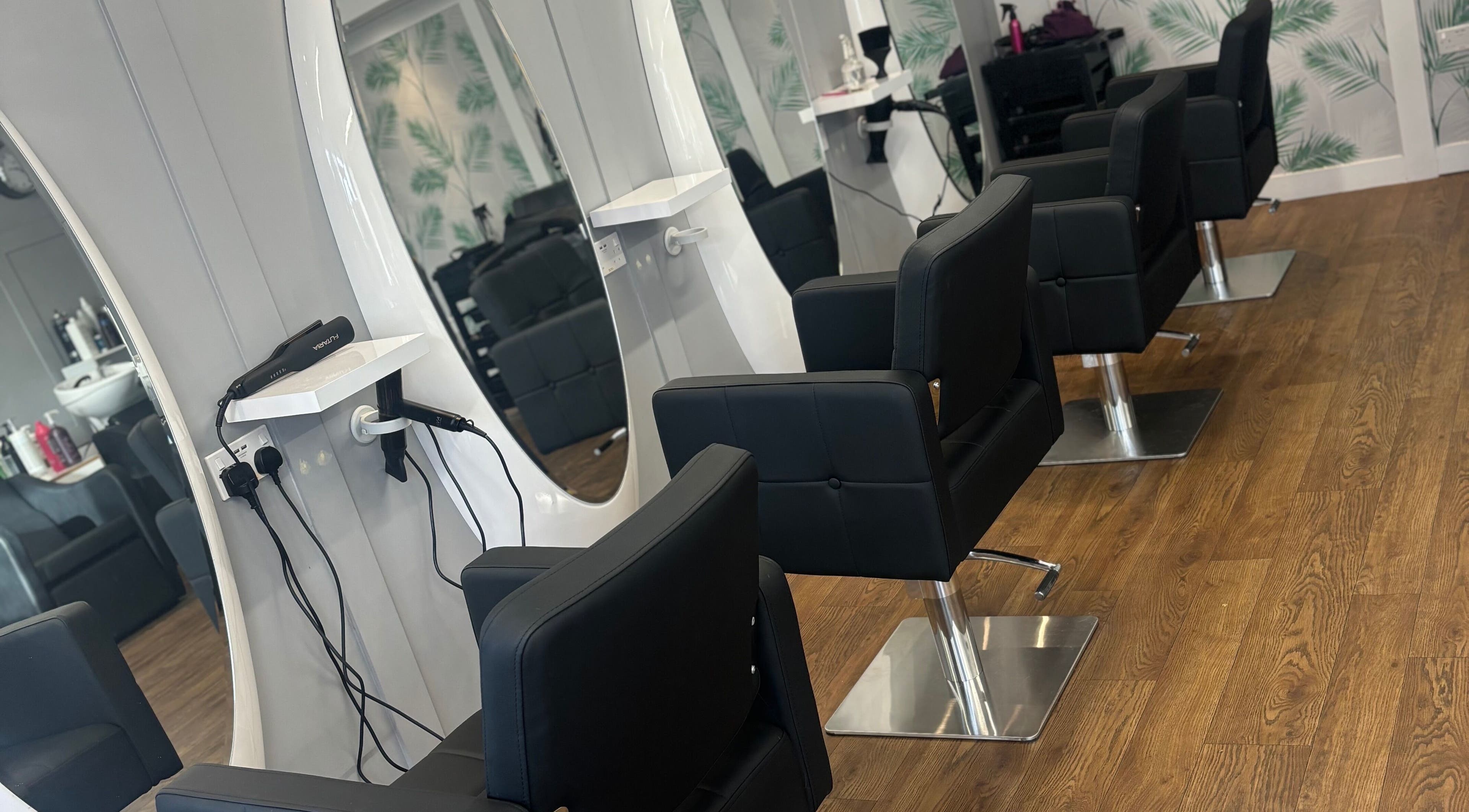 Modern salon chairs and mirrors at Bee Unique Hair and Beauty, Dobwalls, England, GB.