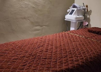Massage room at Awa Salon and Spa, Tumpat, Kelantan, MY, featuring a relaxing brown treatment bed.