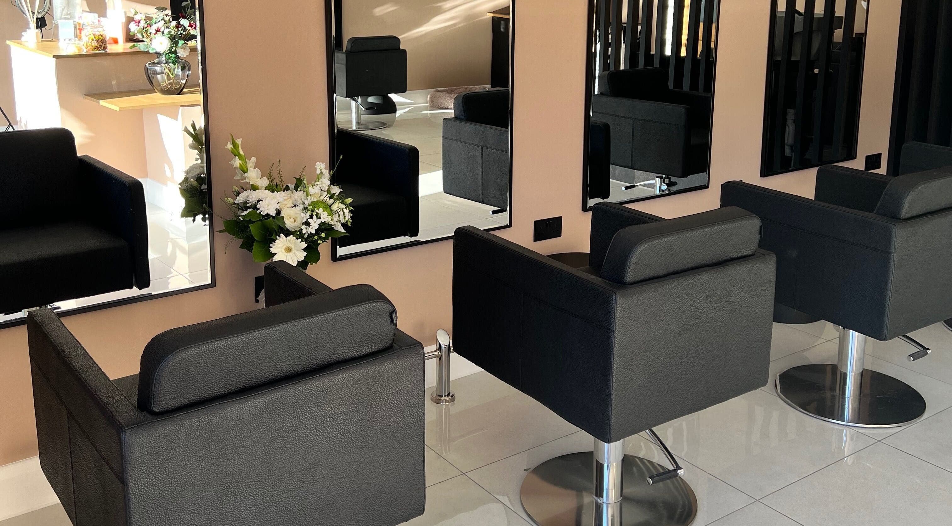 Stylish salon chairs and mirrors at Melissa Gordon Hair in Edinburgh, Scotland, GB create a luxurious ambiance.