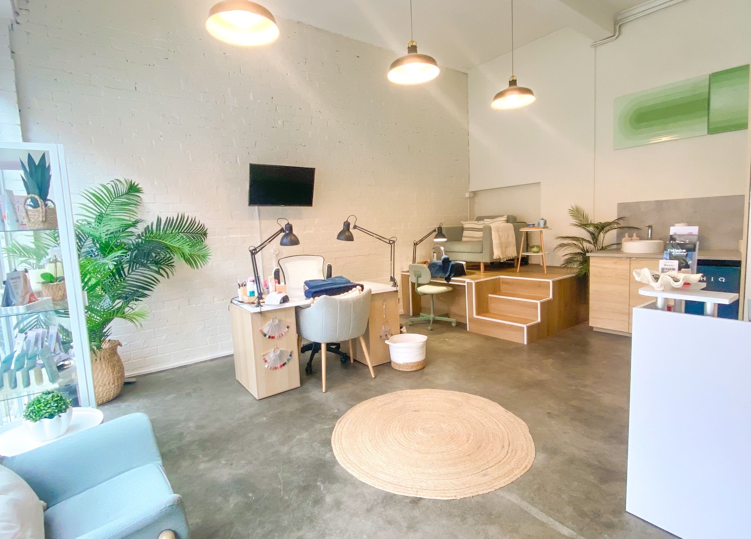 Tranquil interior of The Nail Assembly in Melbourne, Victoria, AU, featuring modern decor and manicure stations.