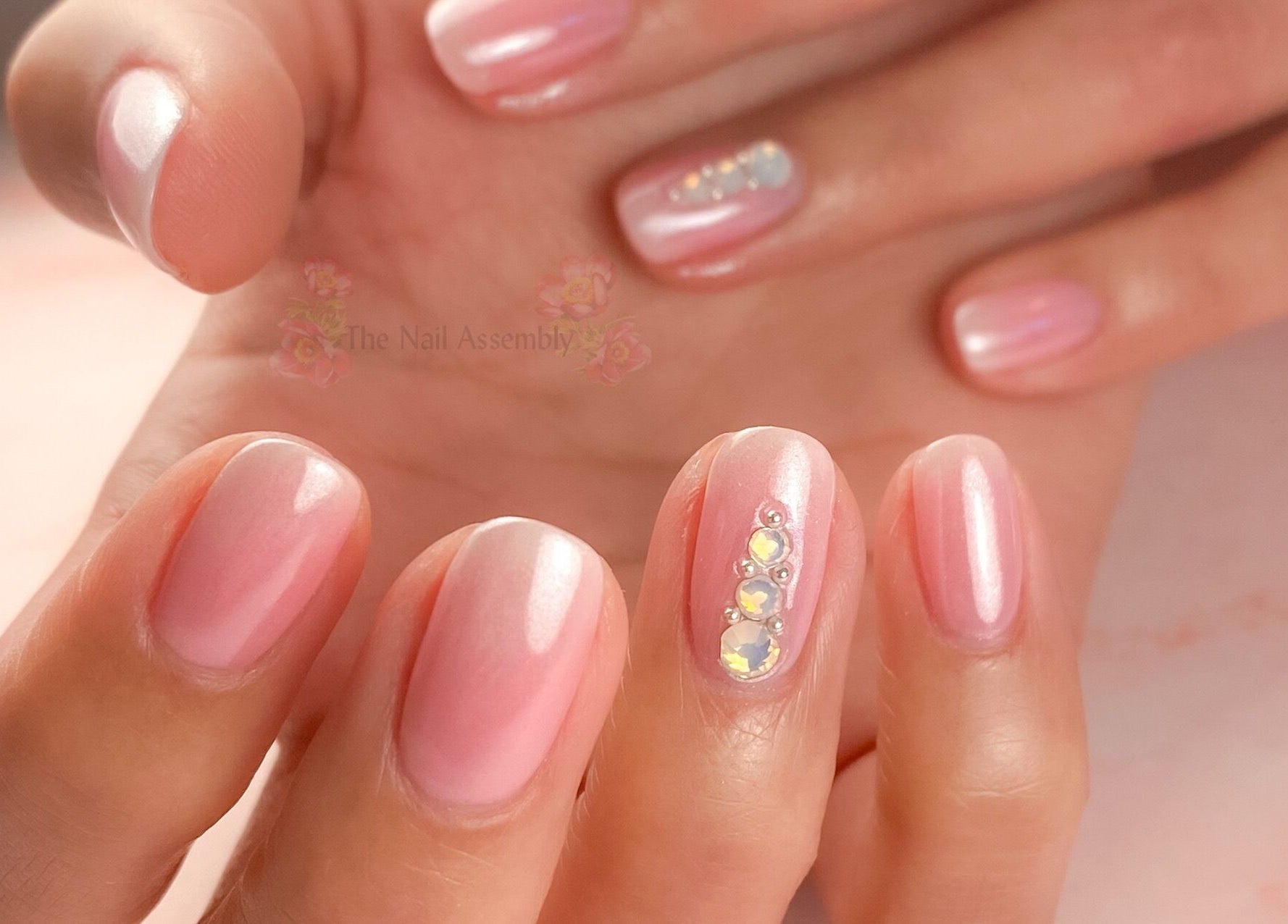 Elegant pink nail art with jewels at The Nail Assembly, Melbourne, Victoria, AU.