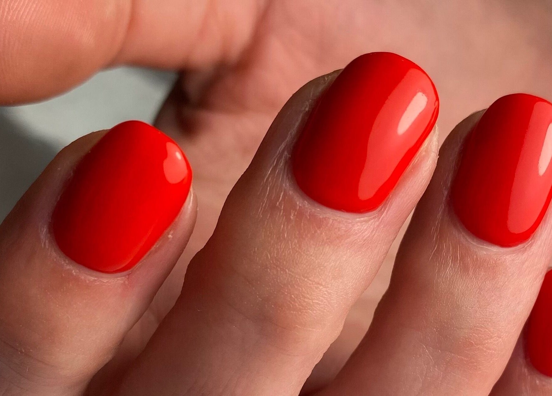 Bright red manicure at The Nail Assembly in Melbourne, Victoria, AU showcasing expert nail artistry.