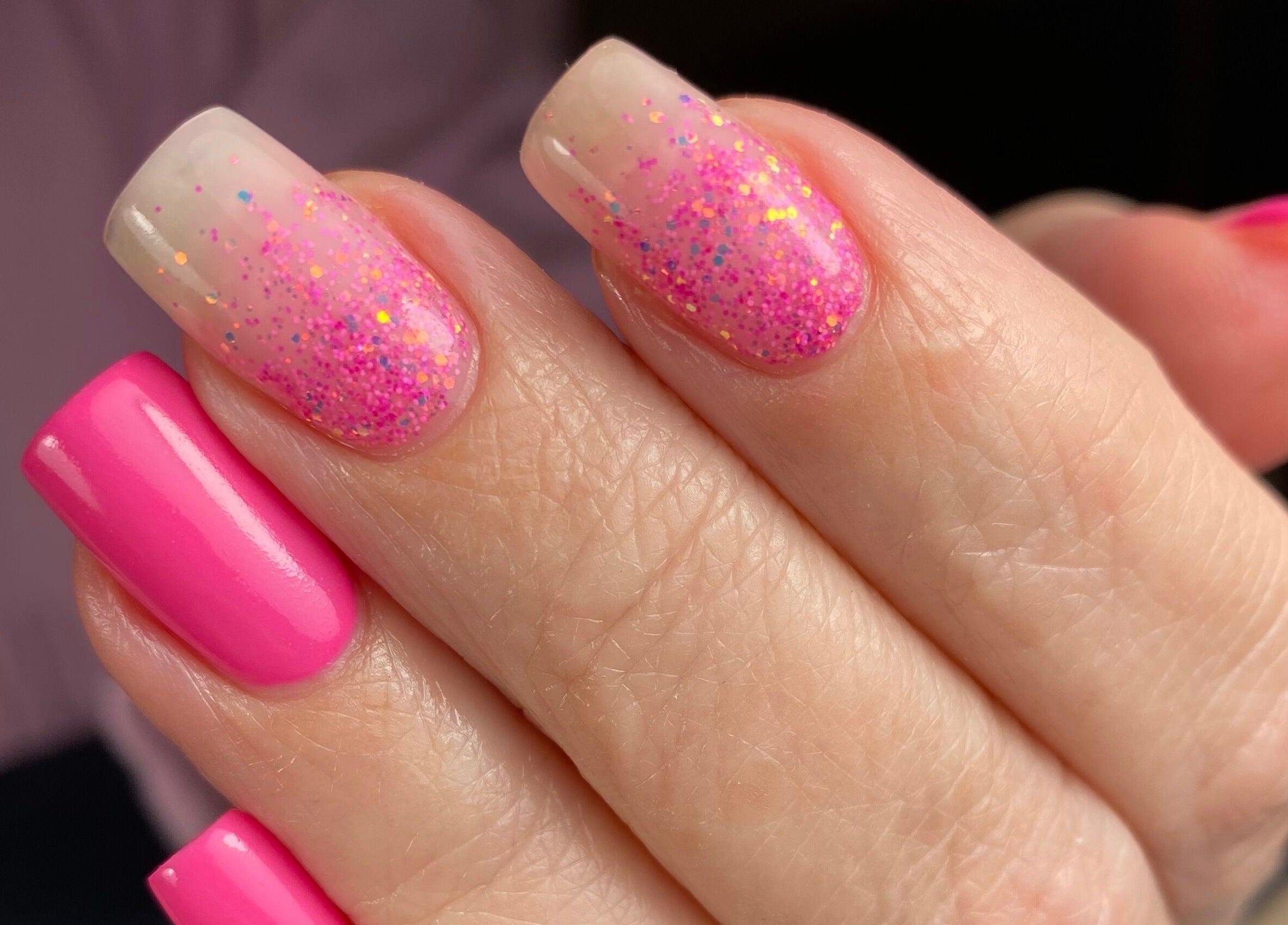 Vibrant pink and glitter nails at The Nail Assembly, Melbourne, Victoria, AU.