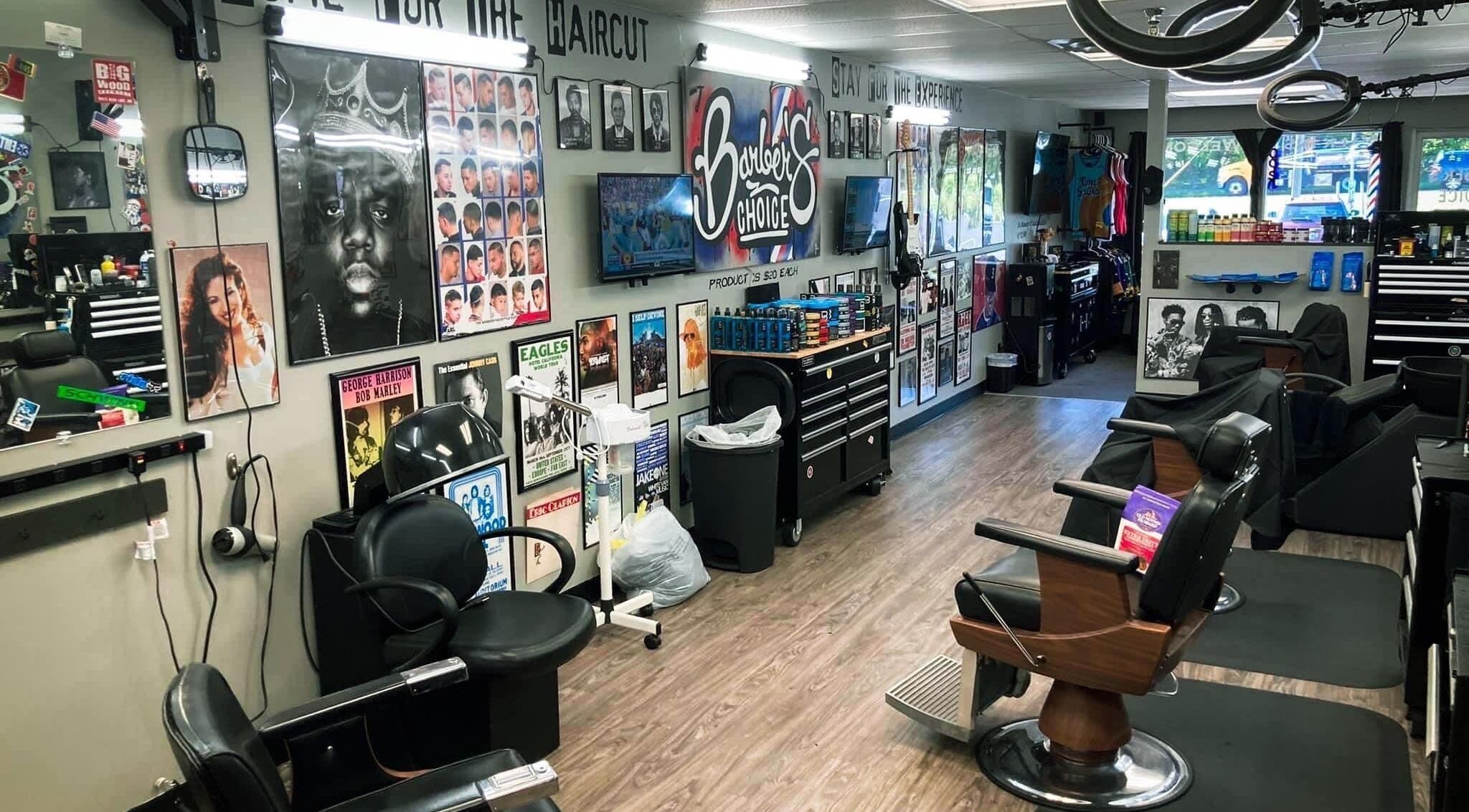 Interior of Barber’s Choice Studio in Oakdale, Minnesota, US, showcasing modern chairs and vibrant wall posters.
