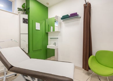 Relaxing treatment room at Vida hair & beauty The Brewery in Romford, England, GB with green decor.
