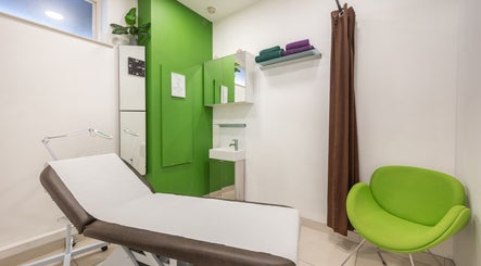 Relaxing treatment room at Vida hair & beauty The Brewery in Romford, England, GB with green decor.