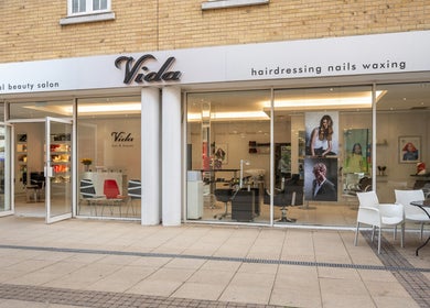 Vida hair & beauty The Brewery in Romford, England, GB showcasing elegant salon front and patio seating.