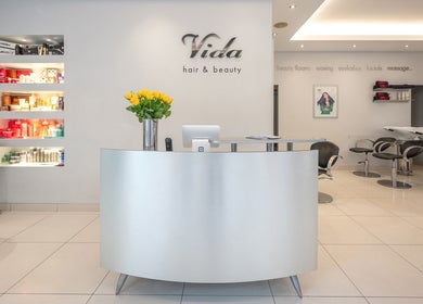 Reception area of Vida hair & beauty The Brewery in Romford, England, GB, featuring sleek modern decor.