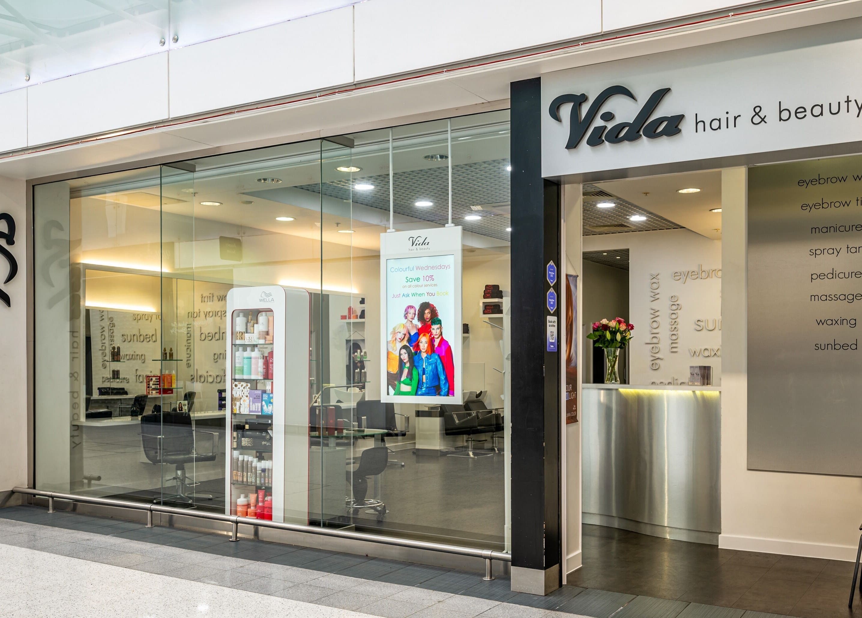 Entrance of Vida Hair & Beauty The Mercury in Romford, England, GB, showcasing the stylish salon interior.